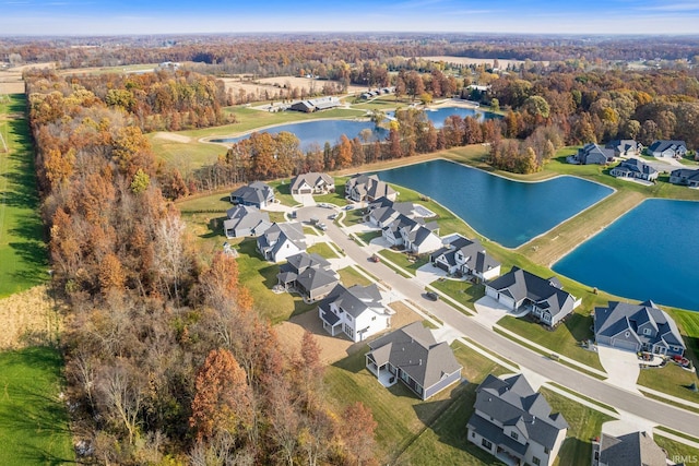 drone / aerial view featuring a residential view and a water view