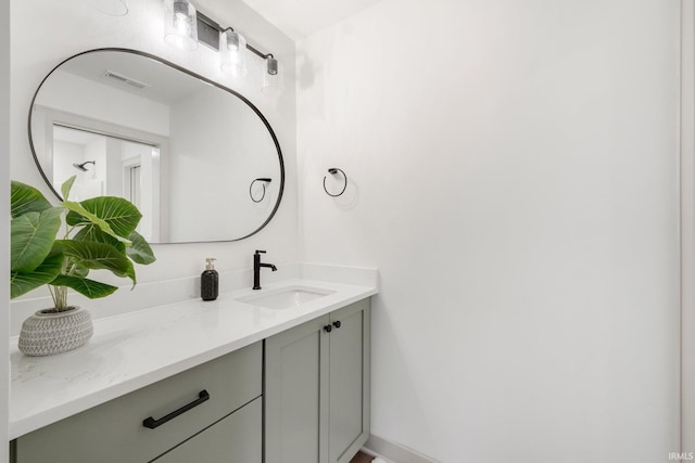 bathroom with vanity and visible vents