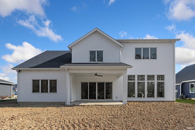 rear view of house with central AC unit, a shingled roof, a patio area, and a ceiling fan