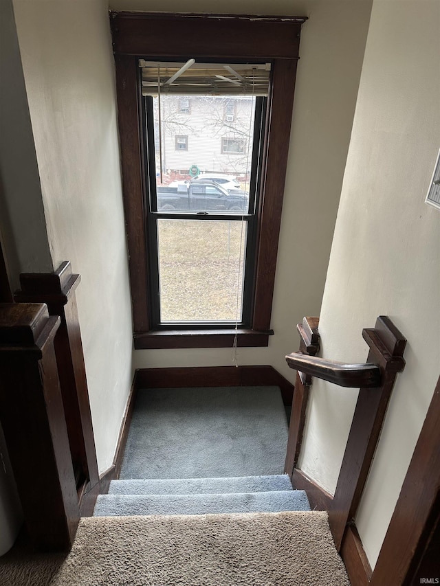 stairway featuring baseboards