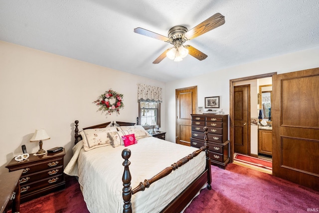 bedroom featuring ceiling fan, dark colored carpet, and a textured ceiling