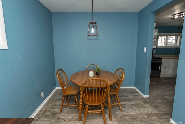 dining space featuring baseboards