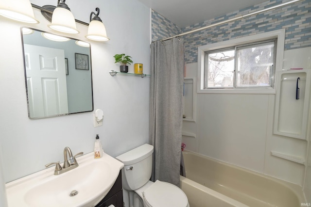 bathroom with vanity, shower / bath combination with curtain, and toilet