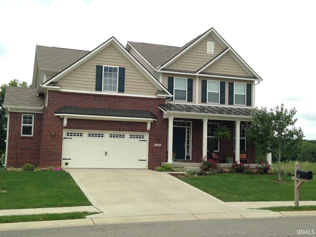 craftsman inspired home with an attached garage, brick siding, driveway, a standing seam roof, and a front yard