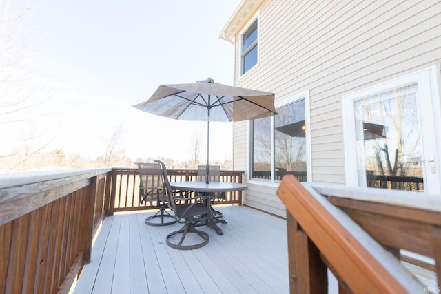 wooden deck featuring outdoor dining space