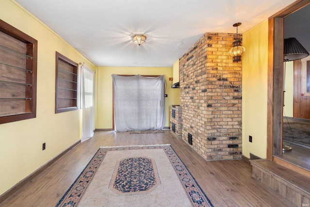 entryway featuring wood finished floors and baseboards