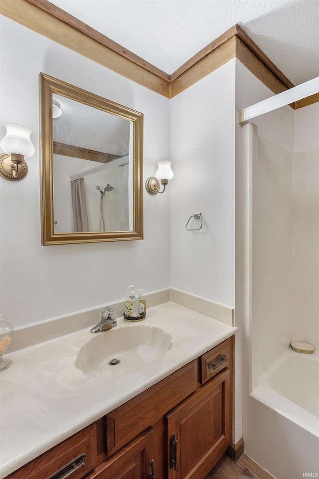 full bathroom with shower / washtub combination and vanity