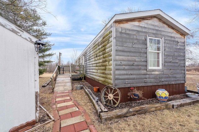 view of side of property featuring an outbuilding