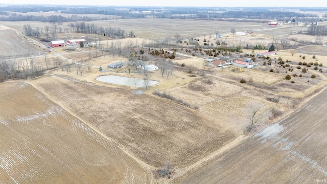 birds eye view of property with a rural view