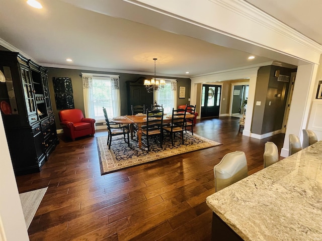 dining area featuring recessed lighting, dark wood-style flooring, baseboards, ornamental molding, and an inviting chandelier