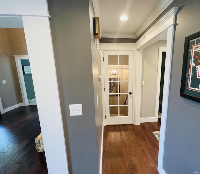 corridor with crown molding, recessed lighting, wood finished floors, and baseboards