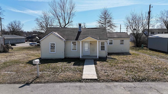 bungalow-style house featuring a shingled roof