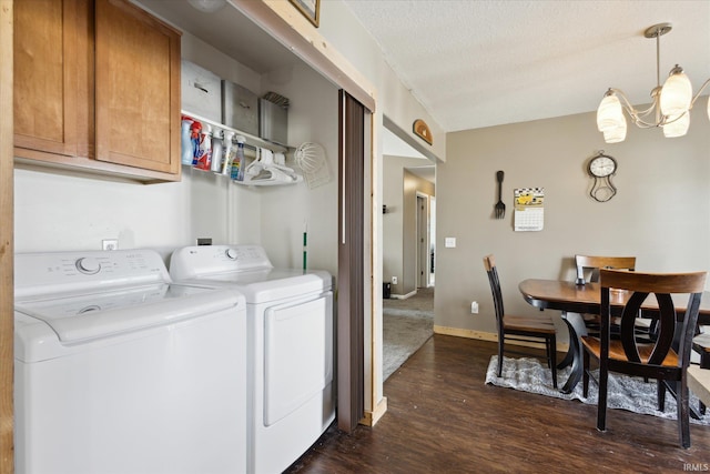 laundry area featuring dark wood finished floors, a textured ceiling, laundry area, independent washer and dryer, and baseboards