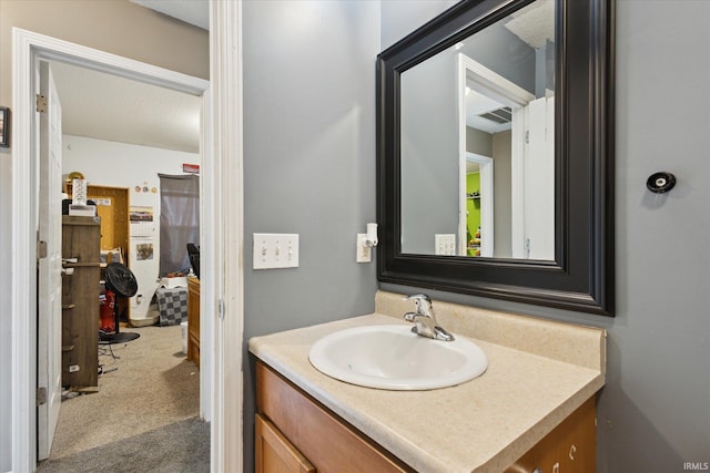 bathroom with visible vents and vanity