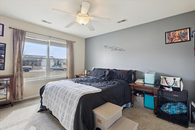 bedroom featuring carpet floors, ceiling fan, and visible vents