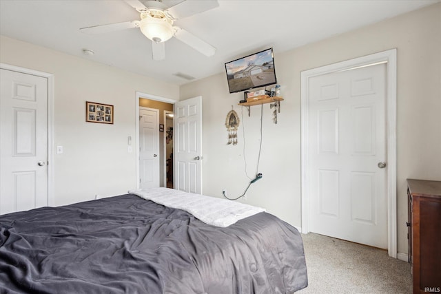 bedroom with ceiling fan and light colored carpet