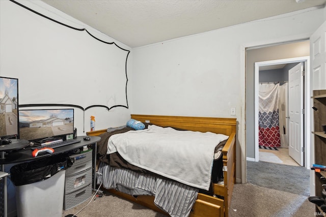 carpeted bedroom featuring a textured ceiling