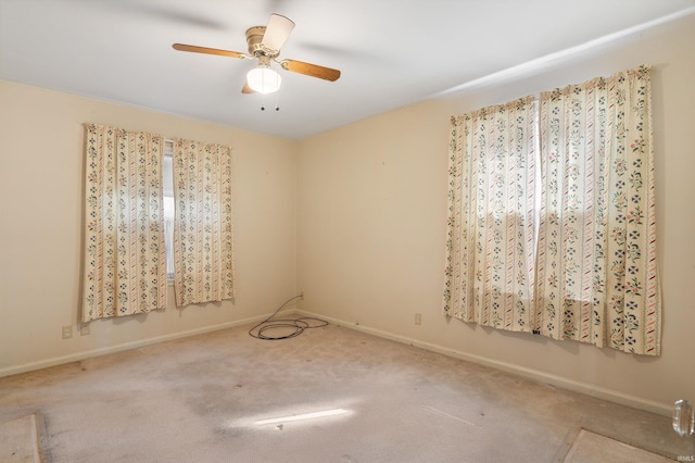 unfurnished room with ceiling fan, carpet, and baseboards