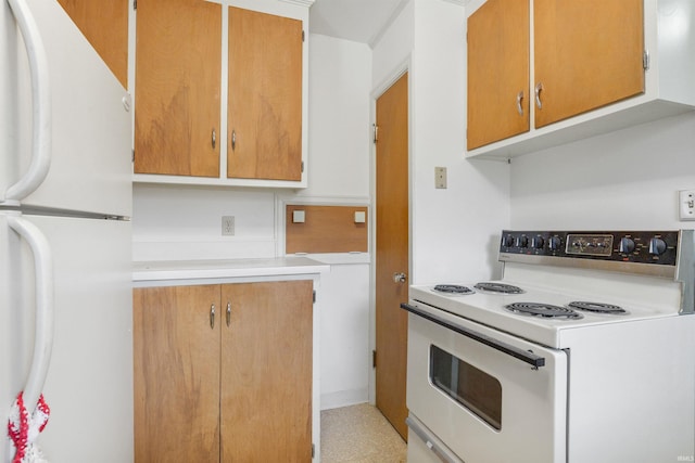 kitchen with white appliances and light countertops