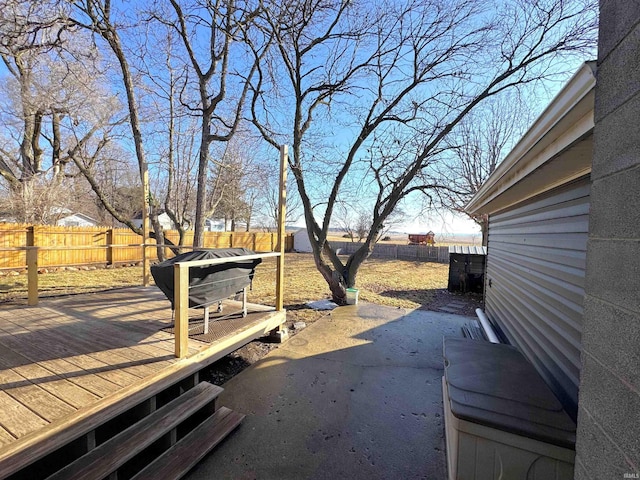 view of yard featuring a fenced backyard and a wooden deck