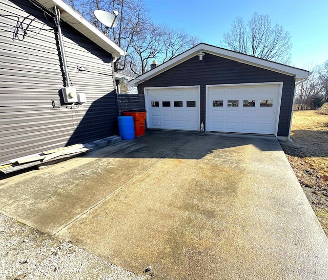 exterior space featuring a garage and an outdoor structure