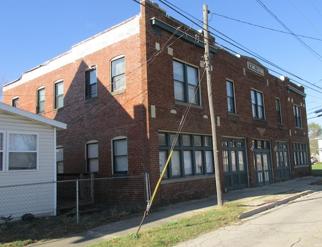 view of property with fence