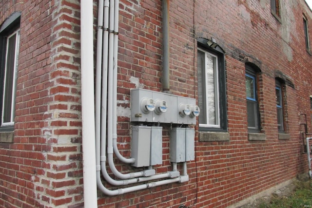 view of side of property featuring brick siding