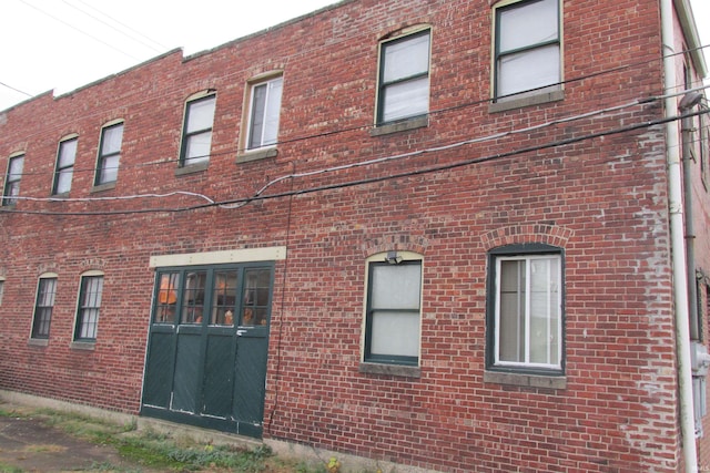 exterior space with brick siding