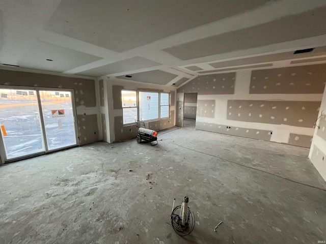 empty room featuring lofted ceiling