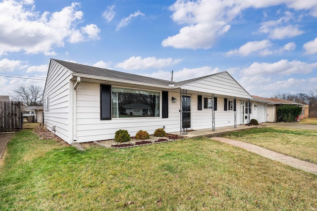 ranch-style home with a front lawn, a porch, and fence