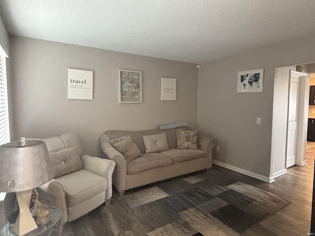 living area featuring baseboards and wood finished floors