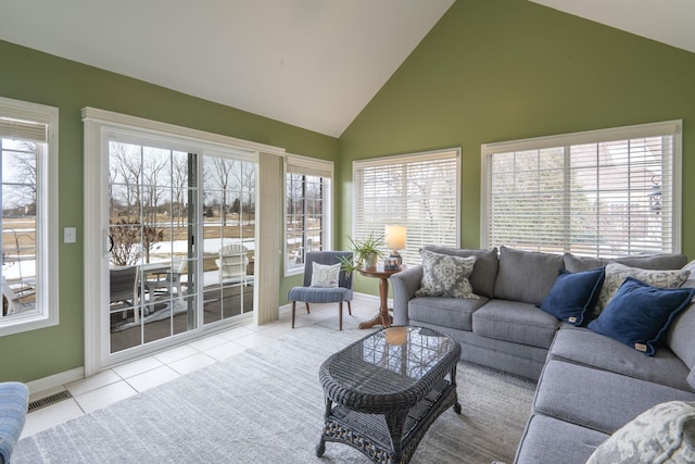 sunroom with lofted ceiling and visible vents