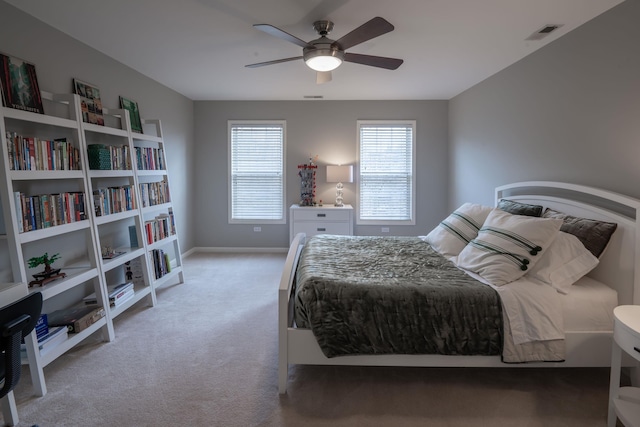 bedroom featuring a ceiling fan, baseboards, visible vents, and carpet flooring