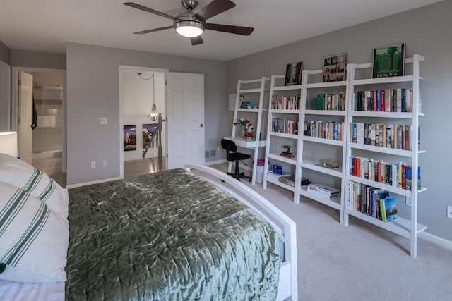 carpeted bedroom with visible vents, ceiling fan, and baseboards