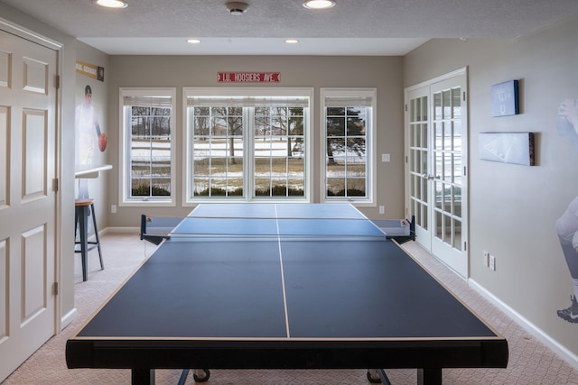 rec room featuring recessed lighting, light carpet, and plenty of natural light