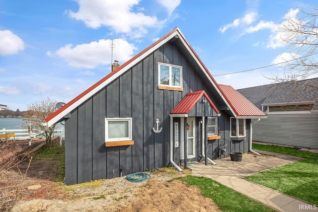 view of front of property featuring metal roof and board and batten siding