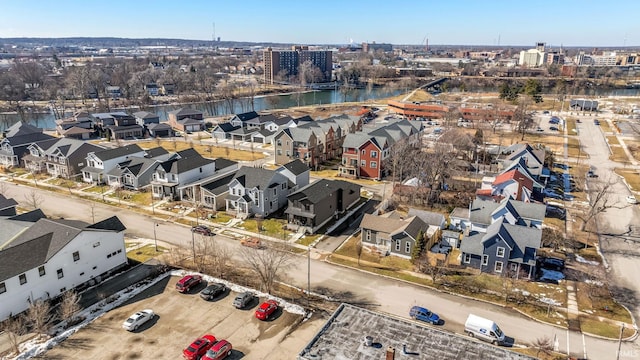 bird's eye view featuring a water view and a residential view