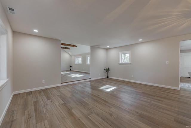 empty room featuring recessed lighting, visible vents, baseboards, and wood finished floors