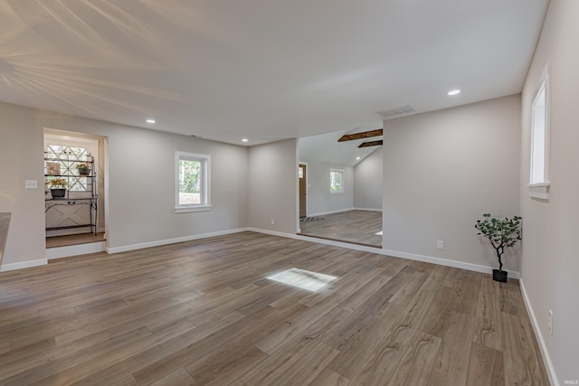 spare room with light wood-type flooring, visible vents, baseboards, and recessed lighting