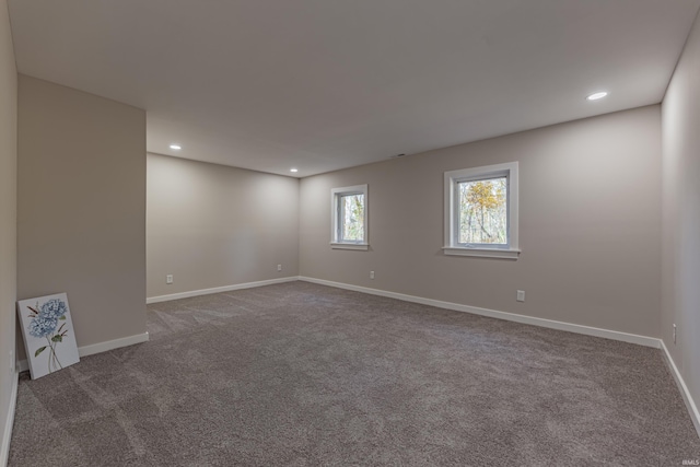 unfurnished room featuring carpet floors, baseboards, and recessed lighting