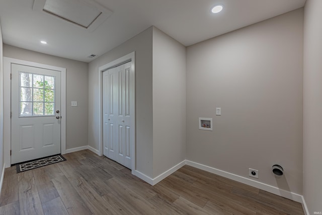 interior space with baseboards, wood finished floors, and recessed lighting