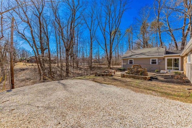 view of yard featuring a fire pit