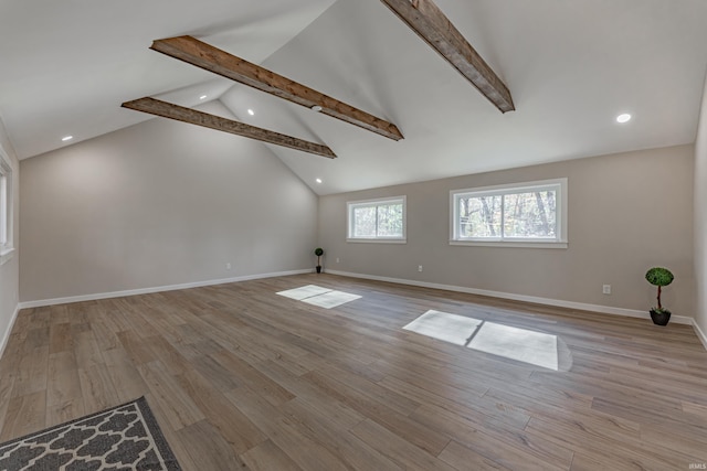 spare room featuring recessed lighting, beamed ceiling, light wood-style flooring, and baseboards