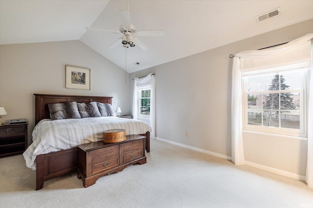 bedroom featuring vaulted ceiling, light carpet, visible vents, and baseboards