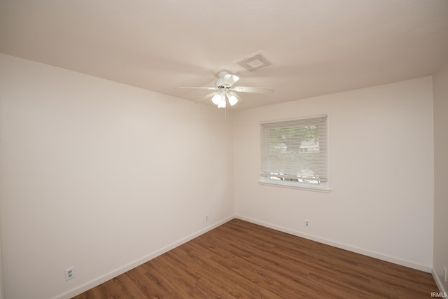 unfurnished room featuring a ceiling fan, visible vents, baseboards, and wood finished floors