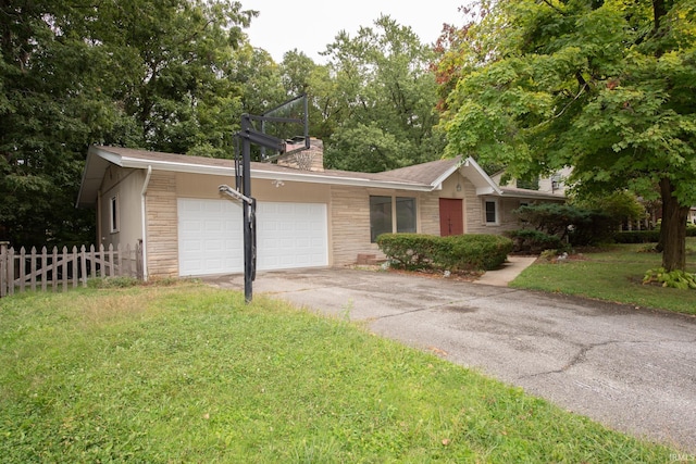 ranch-style house featuring a garage, fence, driveway, a chimney, and a front yard