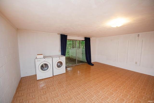 laundry room featuring laundry area, independent washer and dryer, and concrete block wall