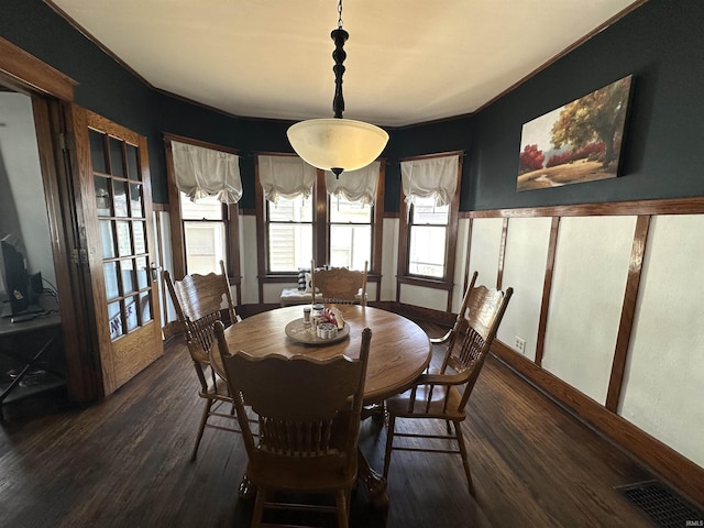 dining area featuring visible vents and dark wood finished floors