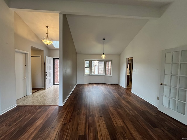 interior space with high vaulted ceiling, dark wood-style flooring, beam ceiling, and baseboards