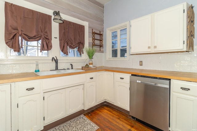 kitchen featuring dishwasher, backsplash, dark wood-type flooring, light countertops, and a sink